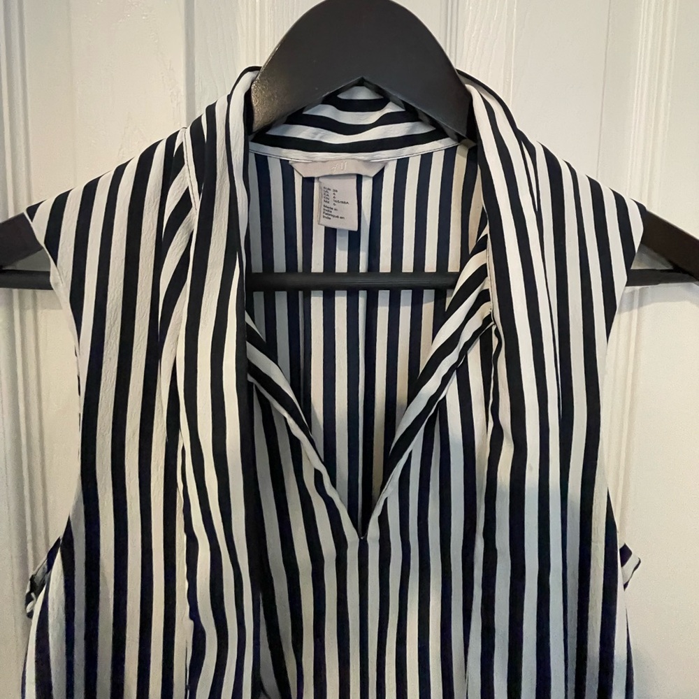 H&M vertical striped (navy and white) blouse with necktie attached to collar.